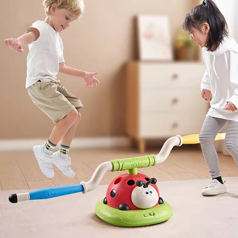 Kids playing musical spinning pole jumping game indoors