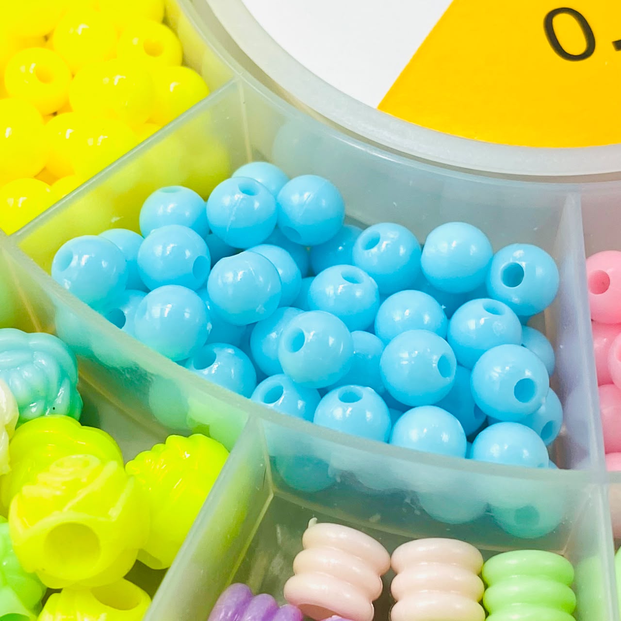 Beads organized in storage compartments
