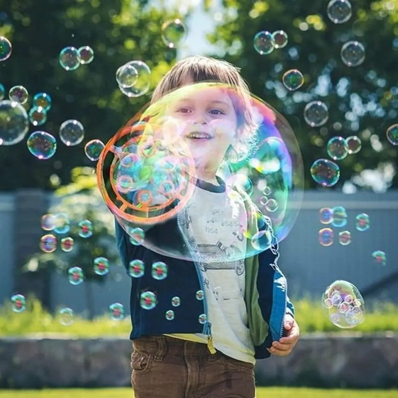 Dinosaur bubble blaster creating bubbles for outdoor play