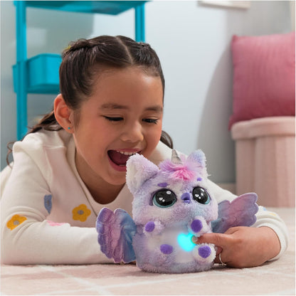 Child playing with interactive Hatchimals Pufficorn