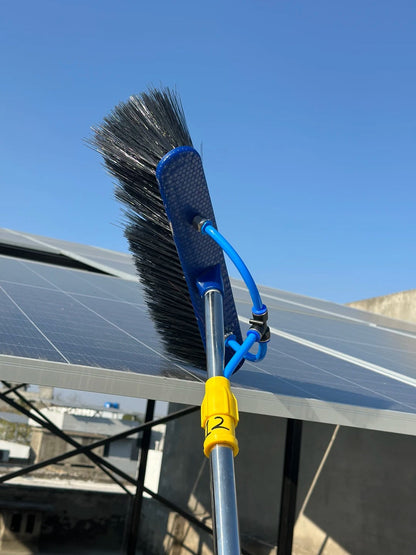 Close-up of solar panel cleaning brush head and water tube