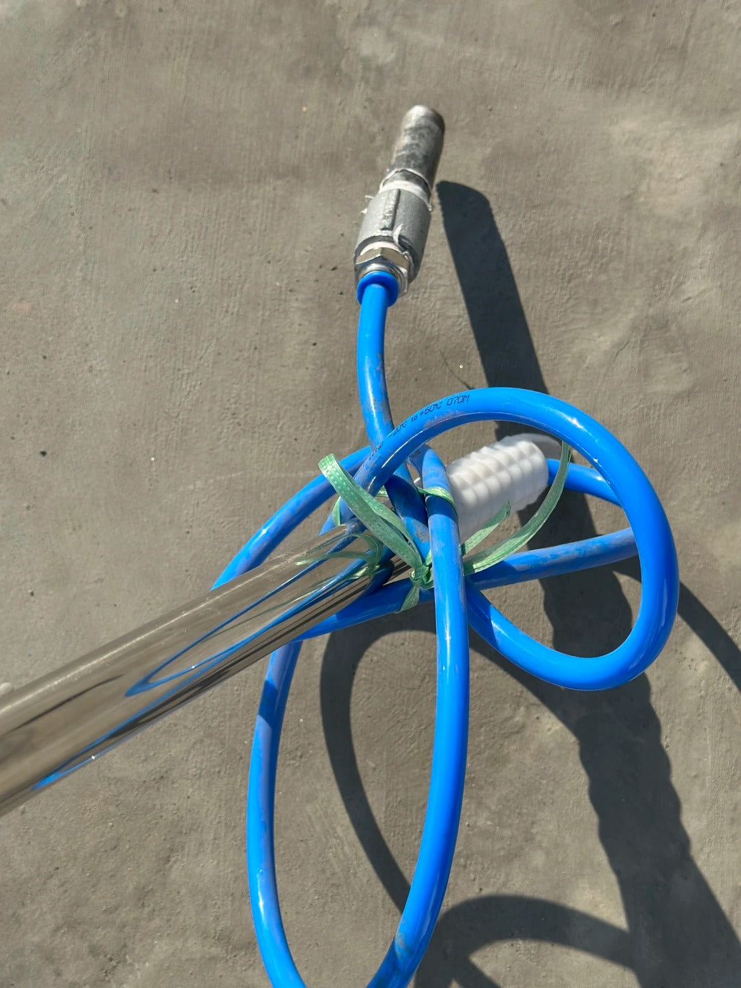 Water hose and connector on extendable solar cleaning pole