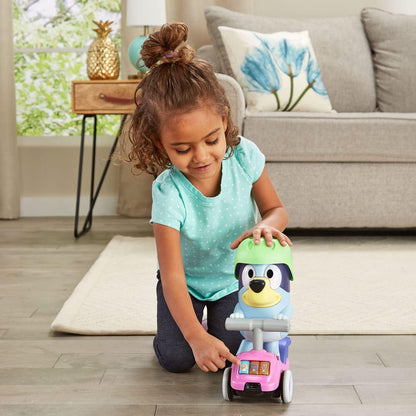 Child pressing buttons on VTech Bluey Scooter Time