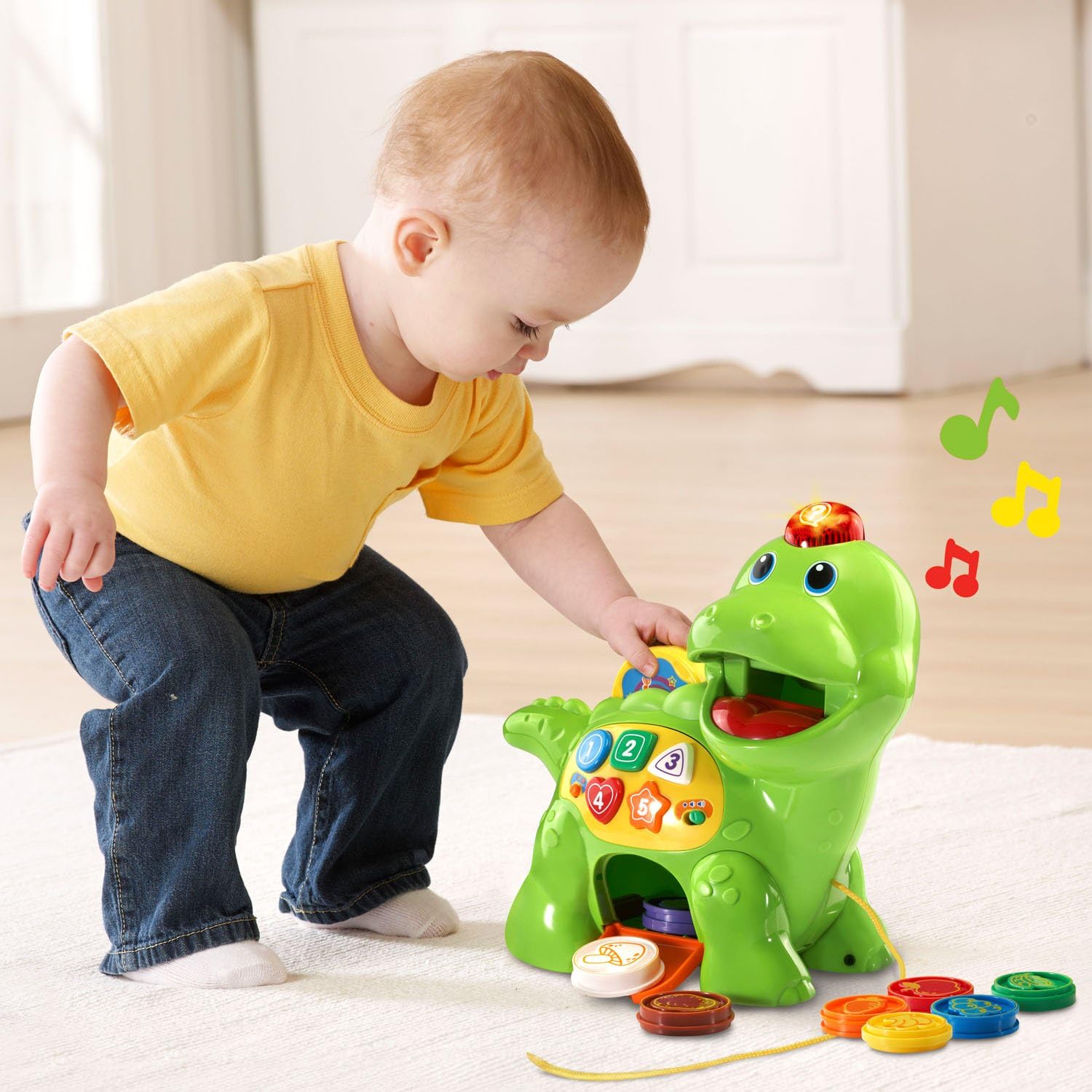 Toddler playing with pull-along Chomp and Count Dino